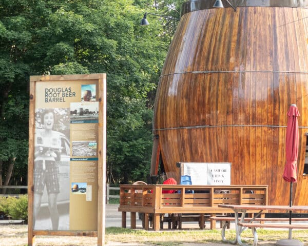 A view of the Root Beer Barrel in Douglas. with an interpretive sign to the left