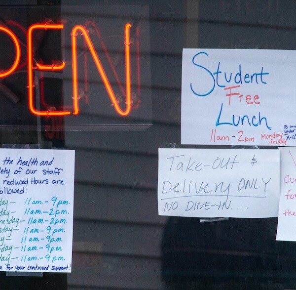 Photo of a shop window with messages related to the shutdown