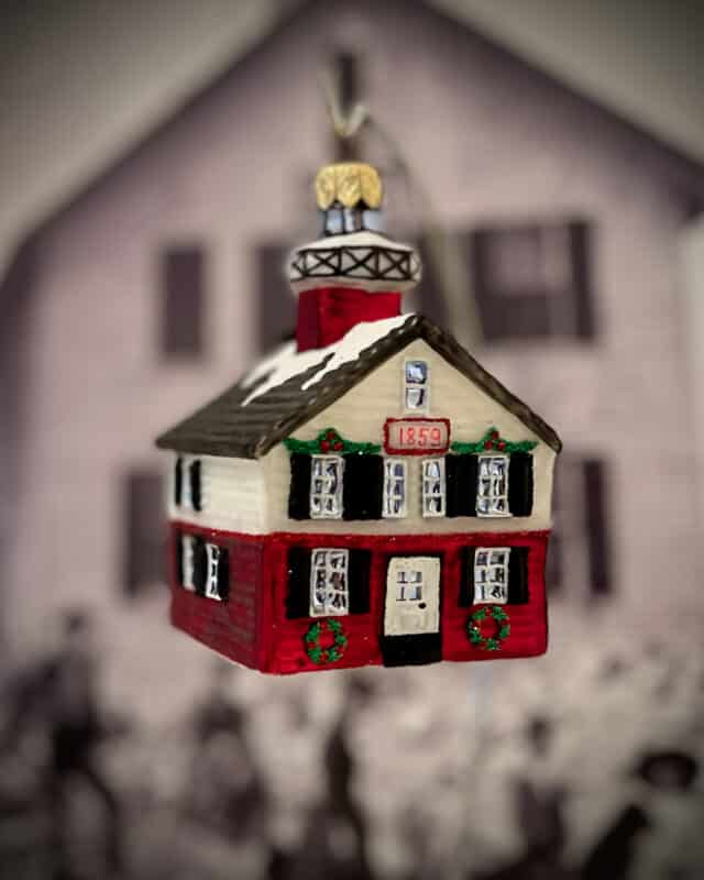 Holiday blown-glass ornament of Kalamazoo River Lighthouse 1859 sold in 2025